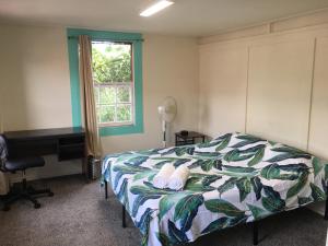 Postel nebo postele na pokoji v ubytování Pahoa Village Hostel