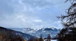 a view of a mountain range with snow covered mountains at Pila 29 in Pila