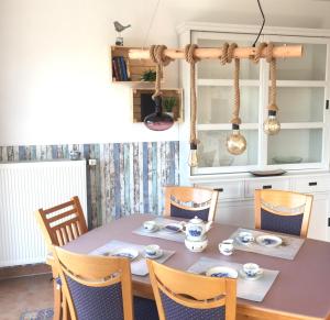 a dining room with a table and chairs at Ferienwohnung Seegang 25493 in Weener