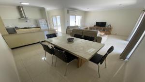 a kitchen and dining room with a table and chairs at Unit 64 Seafront Estate in Jurien Bay