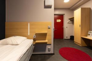 Ein Bett oder Betten in einem Zimmer der Unterkunft Hotel Linnasmäki