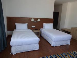Postel nebo postele na pokoji v ubytování Hotel Osel