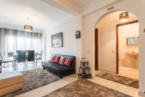 a living room with a couch and a dining room at Best houses 14: Close to the Beach Apartment in Peniche