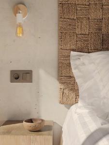 a bedroom with a bed and a bowl on a table at Casa Coco Boutique Hotel & Spa 4*S - Adults Only in Lloret de Mar