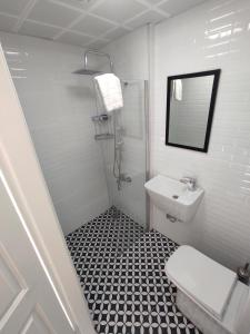 a white bathroom with a sink and a toilet at Basilica Guest House in Istanbul +23 photos