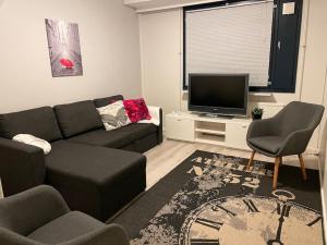 Posezení v ubytování Style 1BR Appartment in Tornio + 3 fotografie
