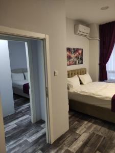 Postel nebo postele na pokoji v ubytování World Center Taksim Hotel