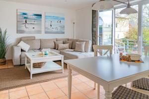 a living room with a couch and a table at Haus Katharina in Lauterbach