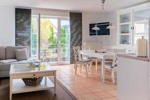 a living room with a kitchen and a dining room at Haus Katharina in Lauterbach