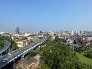 an overhead view of a city with a highway at The Aster Penthouse in Kolkata