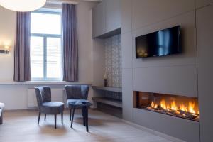 TV a/nebo společenská místnost v ubytování B&B Blomdaele