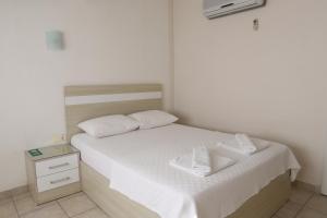 Postel nebo postele na pokoji v ubytování Hotel Binlik