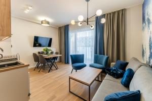 TV a/nebo společenská místnost v ubytování Sunset Resort III, Nadmorska 100A