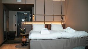 Katil atau katil-katil dalam bilik di Clarion Hotel Winn