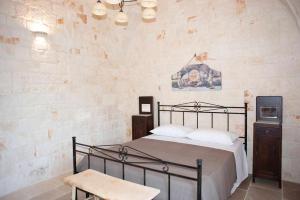 A bed or beds in a room at Dimora Maria Charming Home