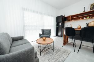a living room with a couch and a table at אירוח בגולן in Qasrîne