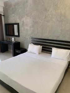 Postel nebo postele na pokoji v ubytování Sunrise Palace Negombo