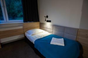 Postel nebo postele na pokoji v ubytování Hotel Halo Szczyrk
