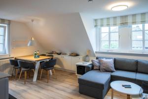 a living room with a couch and a table at Ferienwohnung Wrixumer Marsch in Wrixum