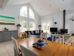 a dining room and living room with a table and chairs at Maison Biscarrosse, 4 pièces, 6 personnes - FR-1-521-93 in Biscarrosse