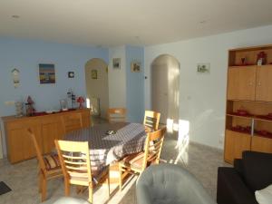 a kitchen and dining room with a table and chairs at Maison Saujon, 3 pièces, 4 personnes - FR-1-71-76 in Saujon