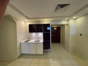 Kuchyň nebo kuchyňský kout v ubytování رؤوم إن للشقق المخدومة-Raoum Inn Serviced Apartments