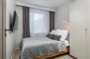 Postel nebo postele na pokoji v ubytování Apartament Holiday 9 + 35 fotografií