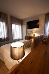 TV a/nebo společenská místnost v ubytování Hotel Ristorante Pennar