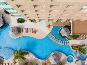 an overhead view of a swimming pool in a building at Gran Mareiro Hotel in Fortaleza