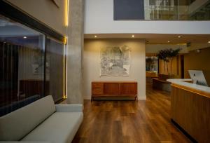 a living room with a couch and a counter at BlackBrick Sandton Two in Johannesburg
