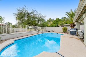 a swimming pool in the backyard of a house at Warm Welcomes on Wahalla Lane in Glendale