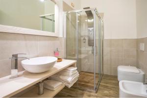 a bathroom with a sink and a shower at Hotel Rifugio Sores in Coredo