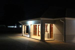 a building at night with lights on it at A pristine BB located in Belvedere Harare - 2006 in Harare