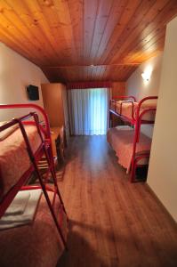 Postel nebo postele na pokoji v ubytování Rifugio Sores Adventure