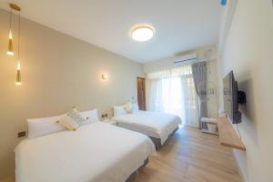 Voodi või voodid majutusasutuse HiHi Skylight toas