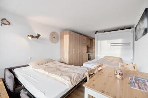 Voodi või voodid majutusasutuse Chaleureux studio à Anzère, accessible à ski, proche de tout toas