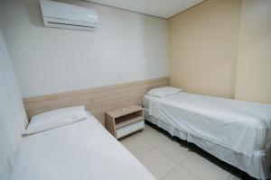 Postel nebo postele na pokoji v ubytování Aquaria Natal Hotel