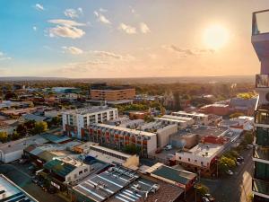 an aerial view of a city with buildings at CBD Stunning TOP Floor View - FREE Parking FREE Netflix FREE Gym FREE Pool FREE Sauna FREE BBQ Area FREE Coffee in Adelaide