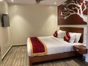 Postel nebo postele na pokoji v ubytování Hotel Ami Grace