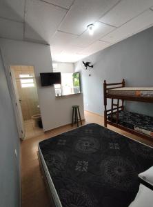 En eller flere senge i et værelse på MARAVISTA SUÍTES Ubatuba