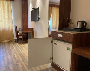 Kuchyň nebo kuchyňský kout v ubytování Hotel Ami Grace