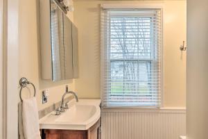a bathroom with a sink and a window at Victorian Home in Penn Yan about 1 Mi to Keuka Lake! in Penn Yan +21 photos