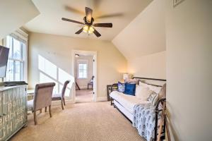 a living room with a couch and a ceiling fan at Carlton Landing Home Walk to Lake and Parks! in Canadian