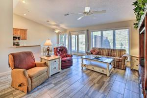 a living room with two chairs and a table at Lovely Hot Springs Home with Lake Balboa Access in Hot Springs Village
