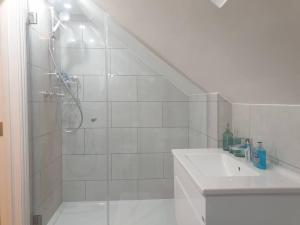 a white bathroom with a shower and a sink at New - Bright London studio loft king bed apartment in quiet street near parks 1074 Lo in London