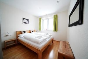 Een bed of bedden in een kamer bij Hölderle Damüls - 12