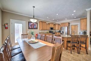 a dining room and kitchen with a table and chairs at Spacious Idaho Home Ski, Hike, and Fish! in Rexburg
