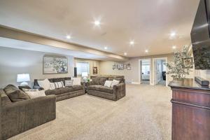 a large living room with two couches and a tv at Spacious Idaho Home Ski, Hike, and Fish! in Rexburg