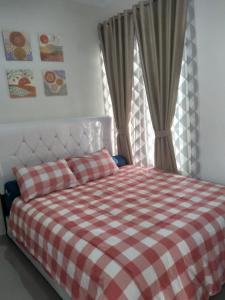 Villa Adinda Syariah D6 객실 침대