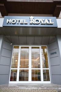 a hotel royal sign on the front of a building at Роял Шумен in Shumen